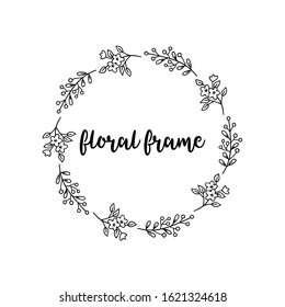 Round frame of twigs and flowers. Black and white vector pattern.