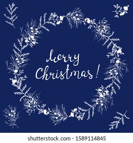 Round frame with winter plants isolated on blue. Calligraphy phrase Merry Christmas. For season greeting cards, posters or advertisement. Vintage style. White and blue.