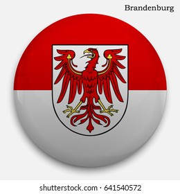 Round glossy Button with flag of Brandenburg, state in Germany, with the reflection of light and shadow realistic.
