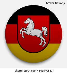 Round glossy Button with flag of Lower Saxony, state in Germany, with the reflection of light and shadow realistic.