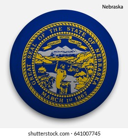 Round glossy Button with flag of Nebraska, state of the USA, with the reflection of light and shadow realistic.