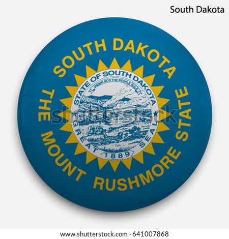 Round glossy Button with flag of South Dakota, state of the USA, with the reflection of light and shadow realistic.