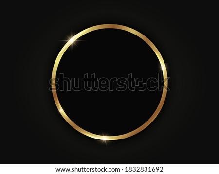 Round golden sparkling frame isolated on a black background.