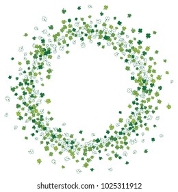 Round green frame, border or background of random scatter clover leaves with tails. Elegant St. Patricks day design for festive banner, greeting card, postcard, flyer. Vector illustration.