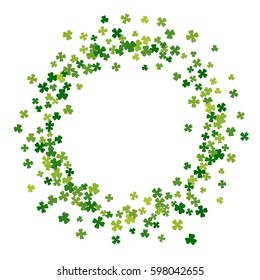 Round green frame, border or background of random scatter clover leaves. Elegant St. Patricks day design for festive banner, greeting card, postcard, flyer. Vector illustration.