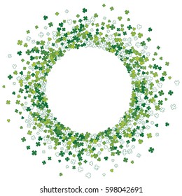 Round green frame, border or background of random scatter clover leaves. Elegant St. Patricks day design for festive banner, greeting card, postcard, invitation, flyer, poster. Vector illustration.