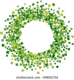 Round green frame, border or background of random scatter clover leaves. Elegant St. Patricks day design for festive banner, greeting card, postcard, flyer. Vector illustration.