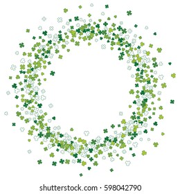 Round green frame, border or background of random scatter clover leaves. Elegant St. Patricks day design for festive banner, greeting card, postcard, invitation, flyer, poster. Vector illustration.