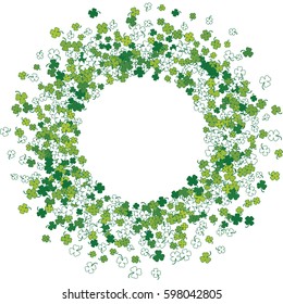 Round green frame, border or background of random scatter clover leaves with tails. Elegant St. Patricks day design for festive banner, greeting card, postcard, flyer. Vector illustration.