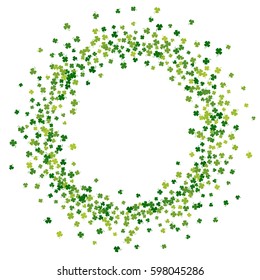 Round green frame, border or background of random scatter clover leaves with tails. Elegant St. Patricks day design for festive banner, greeting card, postcard, flyer. Vector illustration.