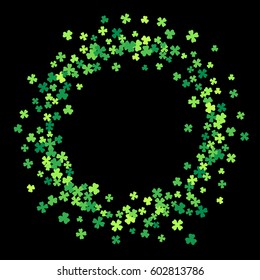 Round green frame, border or background of random scatter clover leaves. Elegant St. Patricks day design for festive banner, greeting card, postcard, flyer. Vector illustration.