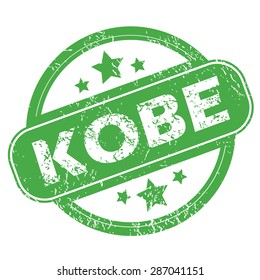 Round green rubber stamp with name Kobe and stars, isolated on white