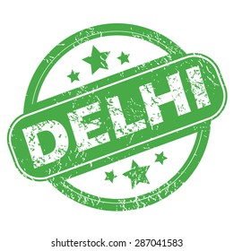 Round green rubber stamp with name Delhi and stars, isolated on white