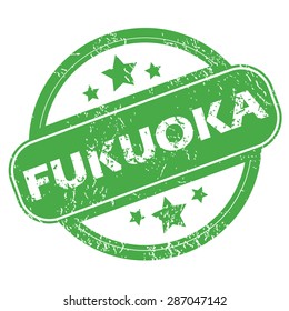 Round green rubber stamp with name Fukuoka and stars, isolated on white