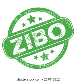 Round green rubber stamp with name Zibo and stars, isolated on white