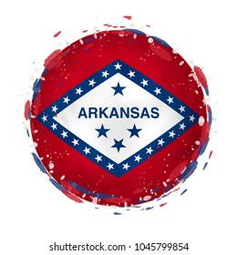 Round grunge flag of Arkansas US state with splashes in flag color. Vector illustration.