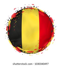 Round grunge flag of Belgium with splashes in flag color. Vector illustration.