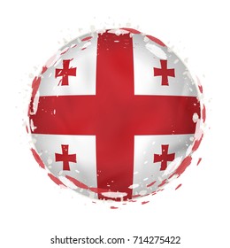 Round grunge flag of Georgia with splashes in flag color. Vector illustration.