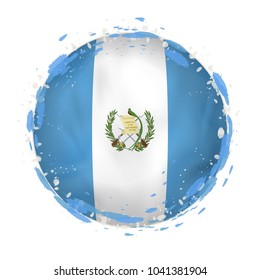 Round grunge flag of Guatemala with splashes in flag color. Vector illustration.