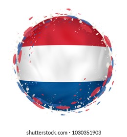 Round grunge flag of Netherlands with splashes in flag color. Vector illustration.