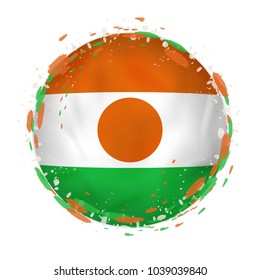 Round grunge flag of Niger with splashes in flag color. Vector illustration.