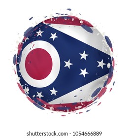 Round grunge flag of Ohio US state with splashes in flag color. Vector illustration.