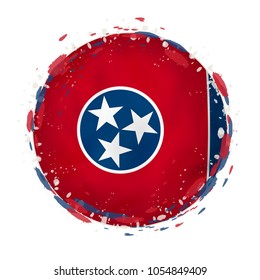 Round grunge flag of Tennessee US state with splashes in flag color. Vector illustration.