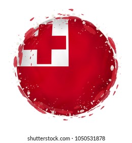 Round grunge flag of Tonga with splashes in flag color. Vector illustration.