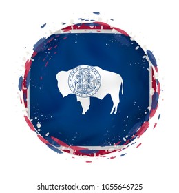 Round grunge flag of Wyoming US state with splashes in flag color. Vector illustration.