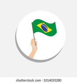 Round icon of the Brazilian flag on a white background. Flag in hand. Isolated Vector Illustration