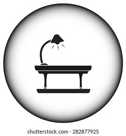 round icon with lamp on table silhouette