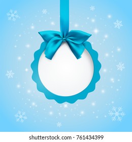 Round label with copy-space. Banner with a blue ribbon and bow. Merry Christmas and New Year winter background with snowflakes. Greeting card template. Minimal design. Vector Illustration.