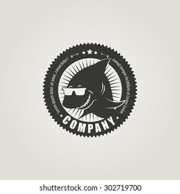 Round label with shark 