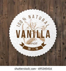 Round label with type design and hand drawn vanilla plant in vintage style