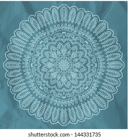 round lace pattern on wrinkled paper