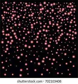 Round luminescent background of a random scatter of red circles with a glowing effect, isolated on black.