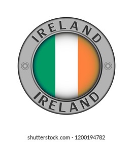 Round metal medallion with the name of the country of Ireland and a round flag in the center