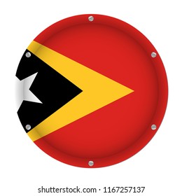 round metallic flag of East Timor with six screws in front of a white background