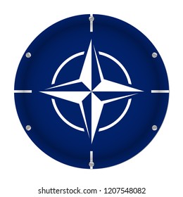 round metallic flag of North Atlantic Treaty Organization with six screws in front of a white background