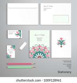 Round pattern. Bouquet of snowdrop flowers. Leaves and branches on backdrop. Vector templates. Envelope, cards, business cards, tags, pencils, eraser.