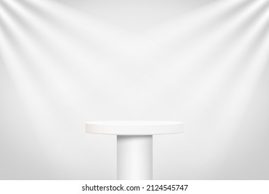 Round pedestal on a stand illuminated by spotlights.