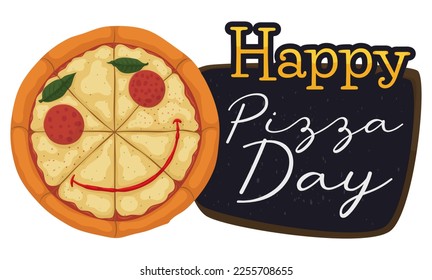 Round pizza with smiling gesture made with pepperoni, basil leaves and ketchup sauce next to a chalkboard with greeting to celebrate a Happy Pizza Day.