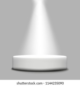 Round podium with a beam of light that shines from above.