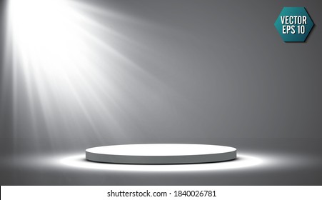 Round podium, pedestal or platform illuminated by spotlights on grey background