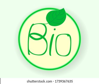 round shadow casting icon with green bio inscription on a light background and a green leaf