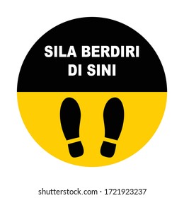 Round shape Please Stand Here in Malay "Sila Berdiri Di Sini" and with shoe prints sign. Social Distancing Instruction Icon. Black and Yellow colour.