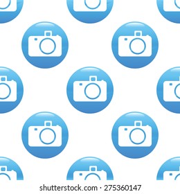 Round sign with image of camera, repeated on white background
