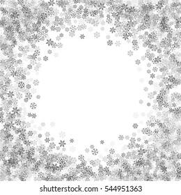 Round silver frame or border of scatter platinum snowflakes on white background. Design element for festive banner, birthday and greeting card, postcard, wedding invitation. Vector illustration.