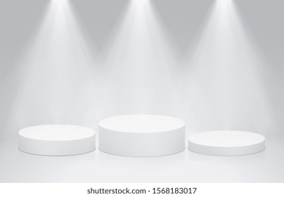 Round stage podium pedestal with bright lighting, spotlights. Winner podium, first second and third place for presentation of trophies or awards.