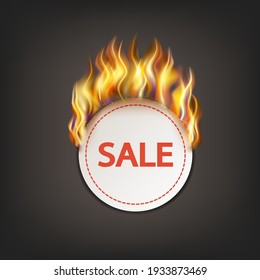 Round sticker or label with fire, advertising for sales. On dark background.